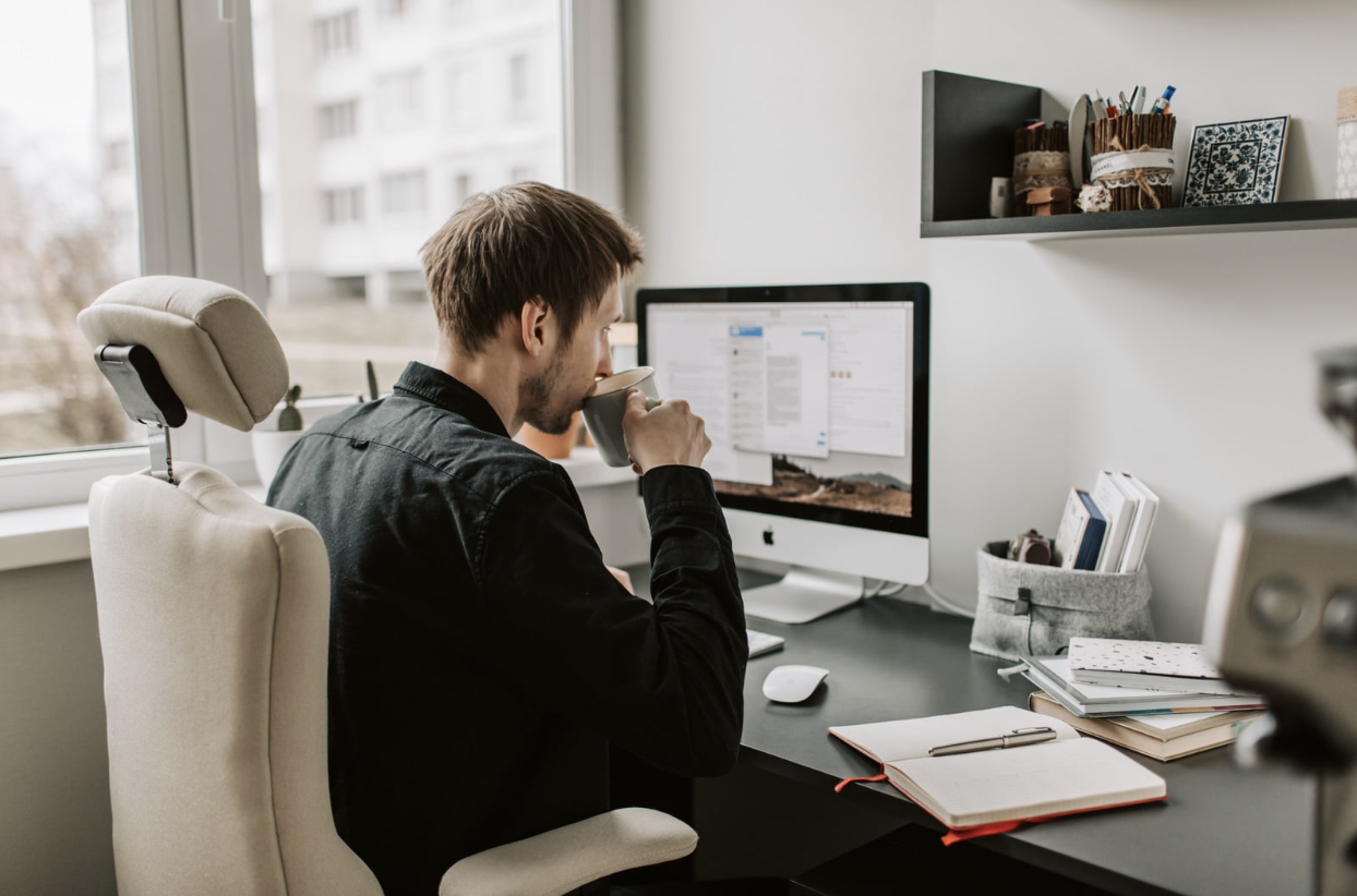 Person completing tax paperwork at a desk